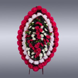 Ритуальный венок овальный красные цветы, лента